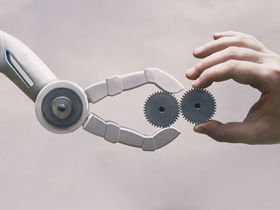 Roboterarm und menschliche Hand